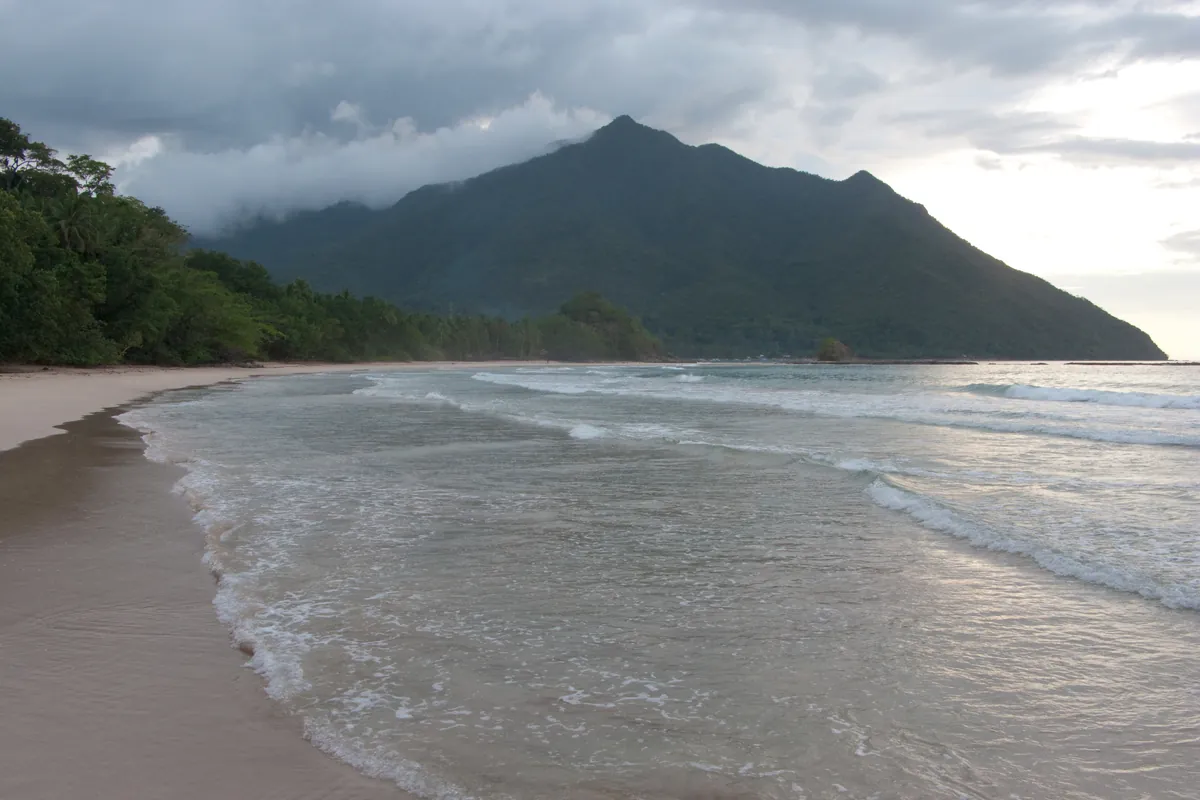 The karst coastline and beach near the mouth of the Underground River